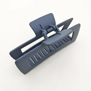Macro view of the large square matte navy hair claw clip showing its textured finish.