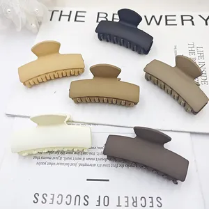 Set of matte rectangular hair claw clips in neutral earth tones for elegant styling