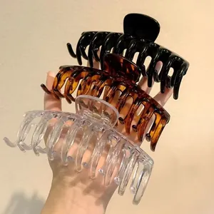 Set of three large hair claw clips in black, tortoiseshell, and transparent acrylic styles