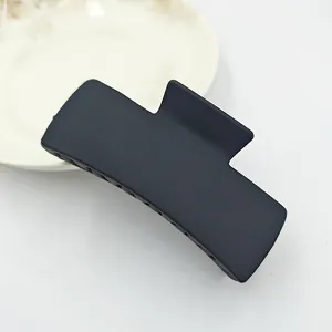Detailed top view of a large matte black square hair claw clip for women's styling