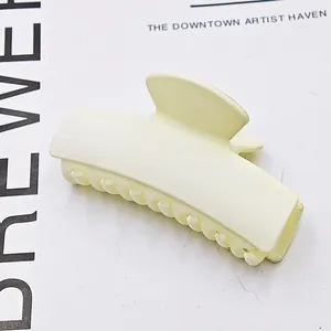 Matte cream rectangular hair claw clip for elegant French style updos and styling