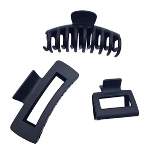Three-piece set of matte black hair claw clips featuring various geometric designs