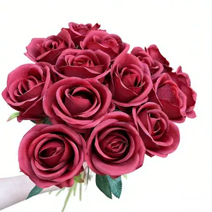 Realistic deep red artificial rose bouquet for wedding and home interior decoration.