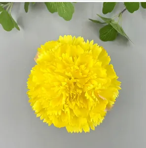 Detailed macro view of a bright yellow artificial carnation flower head for DIY wedding decor
