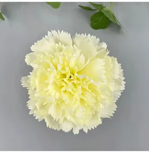 Detailed top-down view of a cream artificial carnation flower head for DIY decor