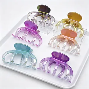 Close-up of UV electroplated gradient hair claw clips in various vibrant colors
