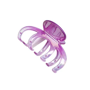 Detailed macro view of a large purple gradient hair claw clip with glossy UV plating.