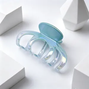 Close-up of iridescent UV-plated hair claw clip with smooth gradient finish