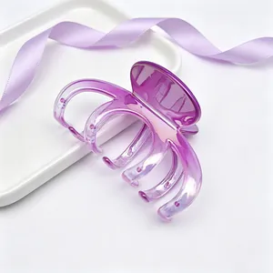 Detail shot of large purple gradient hair claw clip with glossy UV plated finish