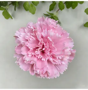 Close-up of pink artificial carnation flower head for DIY wedding home decoration.