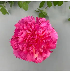 Detailed view of a bright pink artificial carnation flower head for wedding decor