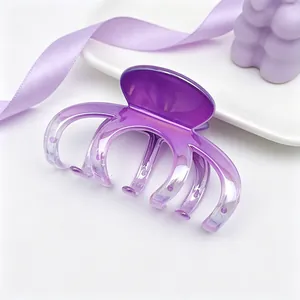 Detail view of the large gradient purple UV-plated shark hair claw clip for women