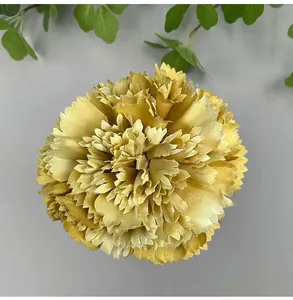 Close-up detail of a bright yellow silk carnation flower head for wedding DIY decor