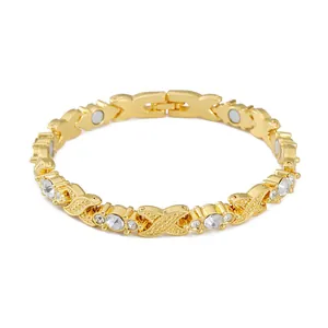 Detailed view of a gold-plated magnetic therapy bracelet with sparkly rhinestones.