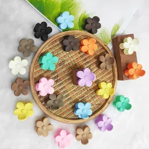 Assorted set of colorful mini flower hair claw clips in matte macaroon and earth tones