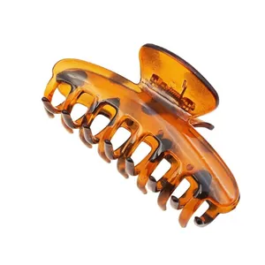 Large leopard print hair claw clip in amber tortoiseshell finish for women hair styling