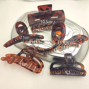 Detailed collection of tortoise shell pattern hair claw clips showing size measurements