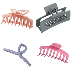Collection of four large matte hair claw clips in various colors and minimalist elegant designs