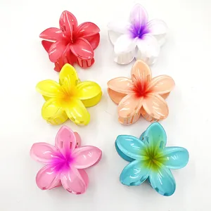 Top view of six colorful flower-shaped hair claw clips for versatile styling options