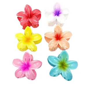 Detailed view of six colorful Plumeria flower hair claw clips in a vibrant set.