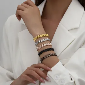 Detail view of five different colored magnetic butterfly link bracelets on a wrist.