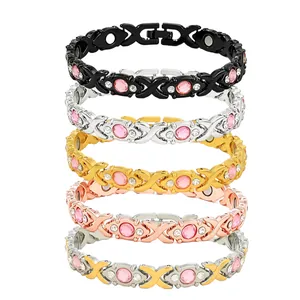 Set of five magnetic bracelets featuring pink rhinestones and cross-shaped metal links.