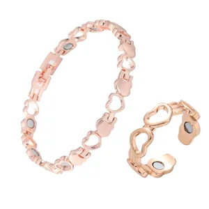 Close-up of rose gold hollow heart magnetic bracelet and adjustable ring set