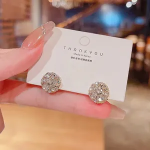 Close-up detail view of sparkling rhinestone ball magnetic earrings for non-pierced ears