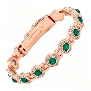 Rose gold magnetic bracelet with emerald-green stones and rhinestones detail view