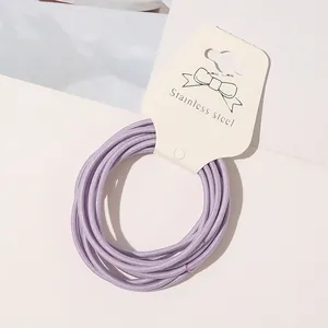 Close-up detail of light purple minimalist high-elastic hair ties on display card