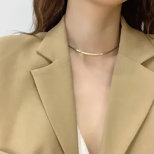 Elegant 18K gold plated stainless steel flat snake chain necklace on model.
