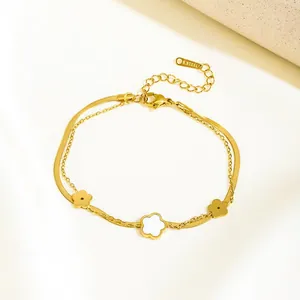 Double-layered gold stainless steel snake chain bracelet with white five-leaf flower charms