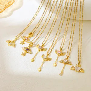 Close-up of elegant gold angel wing necklaces with colorful cat eye stone heart pendants