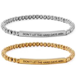 Polished stainless steel 4mm beaded bracelet featuring engraved inspirational quote bar