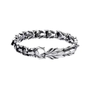 Detailed view of a vintage silver dragon head bracelet with punk hip-hop scale design