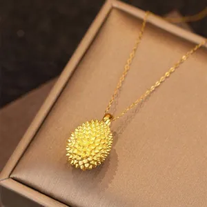 Exquisite gold durian pendant necklace displayed inside a premium brown jewelry box detail