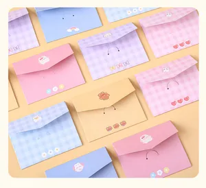 Detail view of assorted cute cartoon tri-fold greeting cards with bear and rabbit illustrations