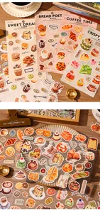 Close-up detail of vintage bakery-themed stickers with cakes and bread for journaling