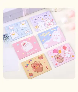 Assorted cute cartoon bear and rabbit folding greeting cards on a pastel background