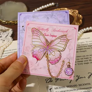 Elegant pink metal butterfly bookmark with purple charm and decorative card display
