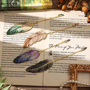 Exquisite metal feather bookmarks with colorful enamel detailing and delicate gold chains