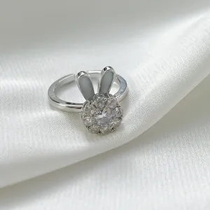 Detailed view of the sparkling stones and bunny ear design of the adjustable ring