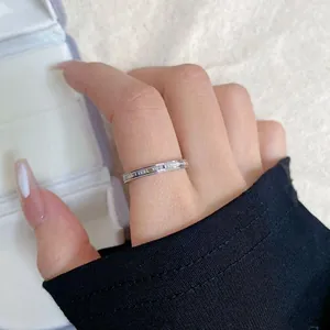 Detailed macro shot of a silver stainless steel ring with I feel you everywhere engraving