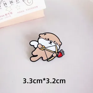 Detail view of cute otter enamel pin showing 3.3x3.2cm dimensions for size reference.