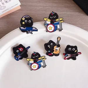 Set of cartoon black cat music band enamel pins with guitar, drums, and keyboard detail