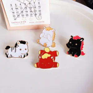 Close-up of four cute cartoon horse enamel pins as Chinese New Year mascot gifts