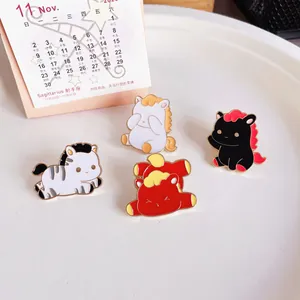 Close-up of four cute horse enamel pins with zodiac theme for 2026 Year of the Horse