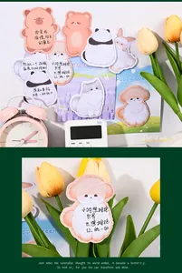 Close-up of cute animal-shaped sticky notes with inspirational quotes for journaling