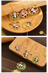 Detailed view of various cute panda-themed metal bookmarks with elegant gold chains
