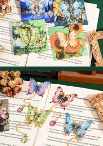 Detail of exquisite hollow metal butterfly bookmark with enamel finish and chain